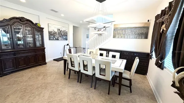 a view of a house with a yard and sitting area