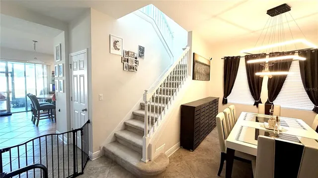 an aerial view of a house with outdoor space swimming pool patio and lake view