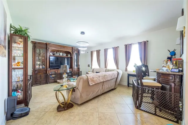 an aerial view of residential houses with outdoor space and swimming pool