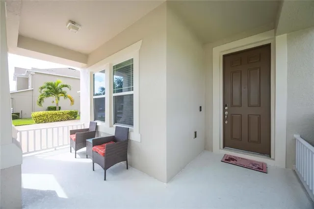 a kitchen with a table chairs sink and cabinets