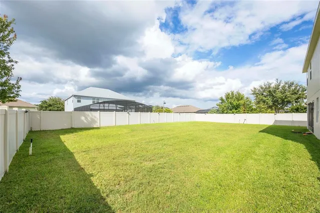 a kitchen with stainless steel appliances kitchen island granite countertop a sink stove and cabinets