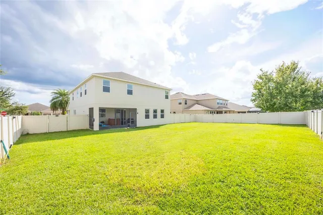 a kitchen with a table and chairs in it