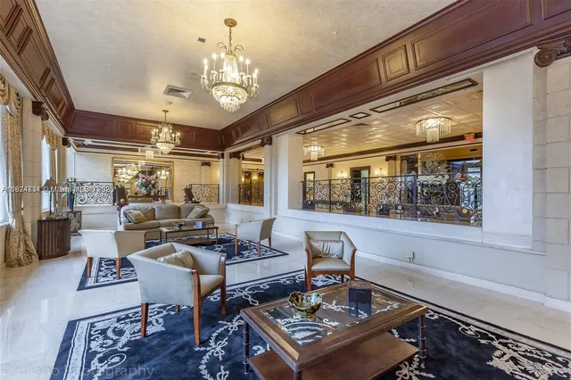 a room with pool table and windows