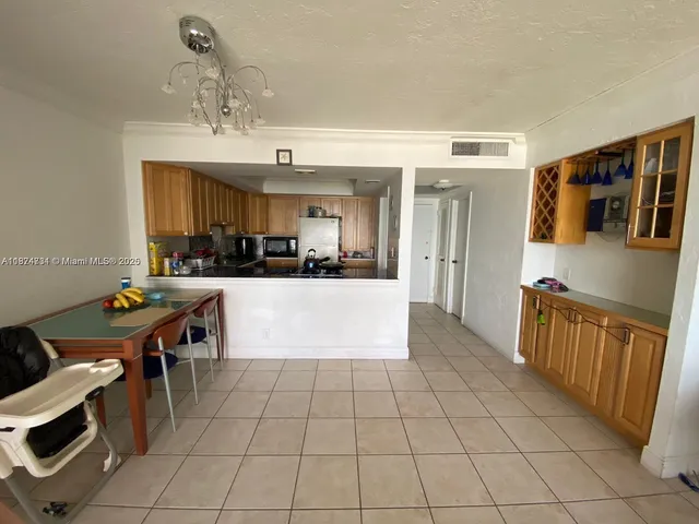 a view of kitchen with cabinets
