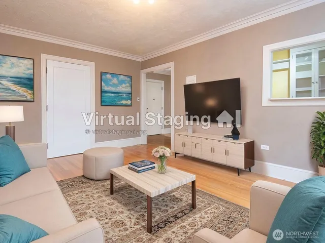 a living room with furniture and a flat screen tv