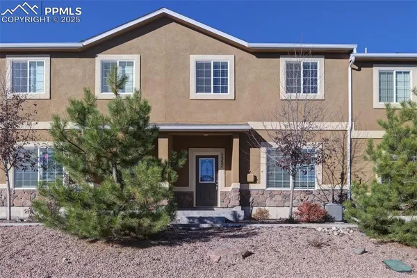 a front view of a house with yard