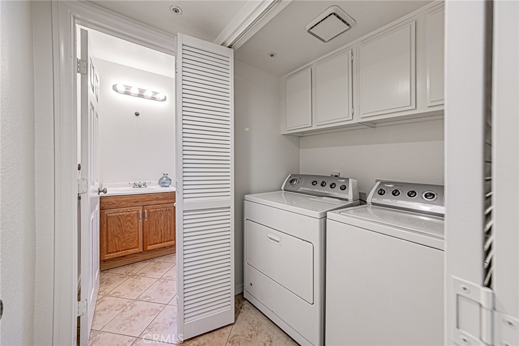 15377 Tobarra Road Fontana, CA 92337 - Photo 14 of 38 Convenient downstairs hallway laundry closet with included washer and dryer