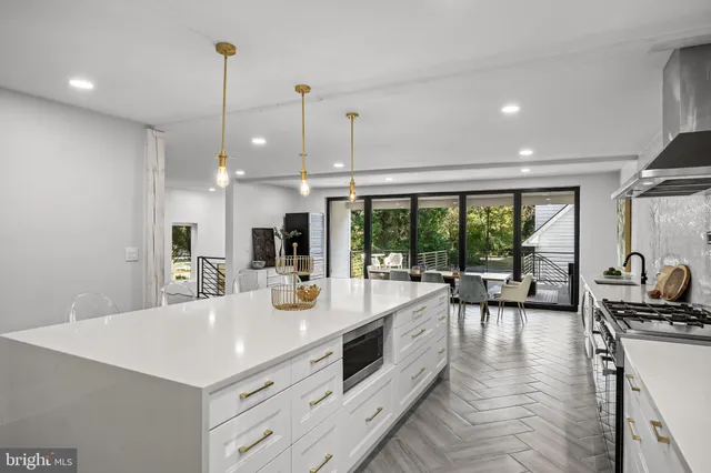 a stove top oven sitting inside of a kitchen