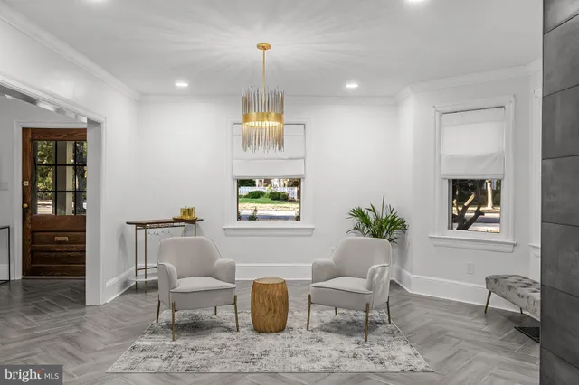 a bathroom with a sink toilet and window