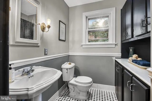 a view of entryway with furniture and wooden floor