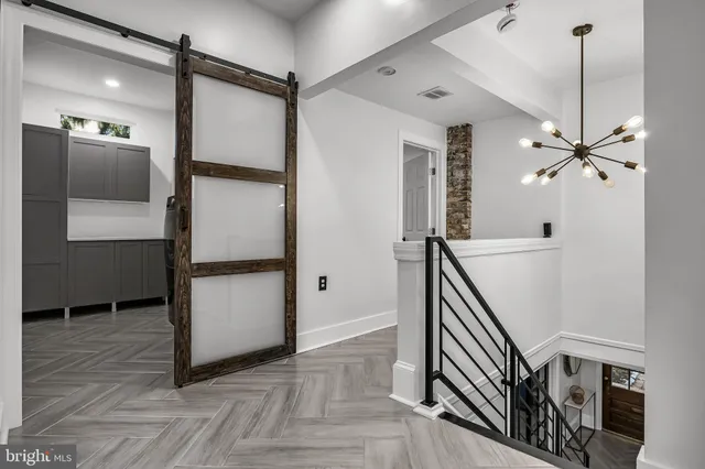 a room with a large window and a rug