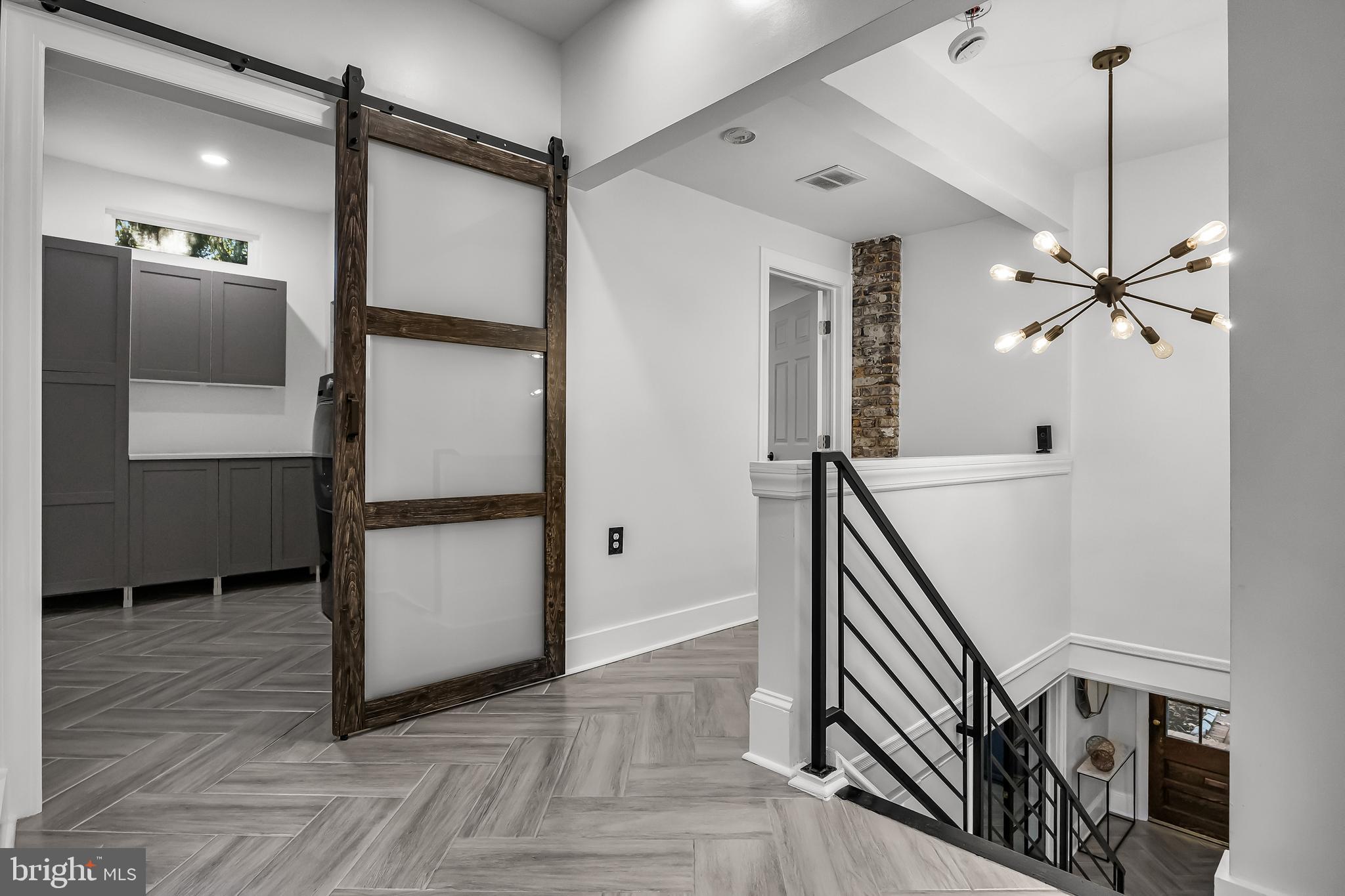 514 East Main Street Moorestown, NJ 08057 - Photo 23 of 60 a view of a hallway with wooden floor and staircase
