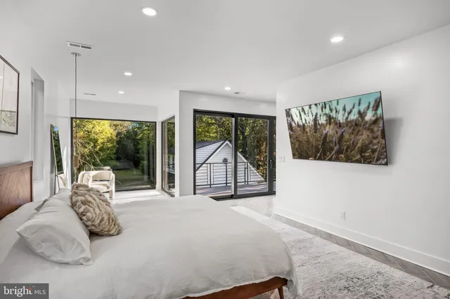 a view of a balcony with wooden floor and fence