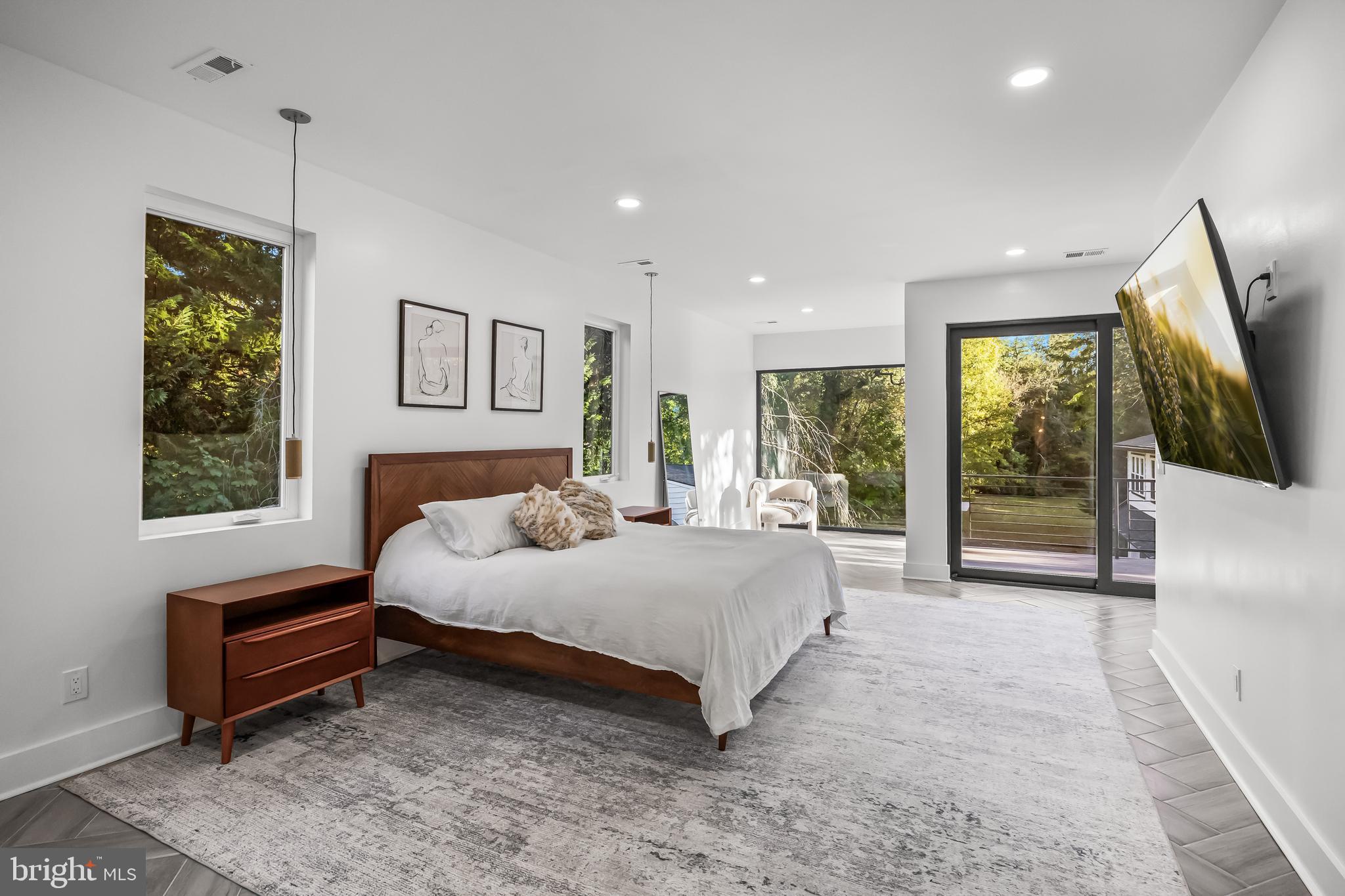 514 East Main Street Moorestown, NJ 08057 - Photo 25 of 60 a spacious bedroom with a bed and glass wall