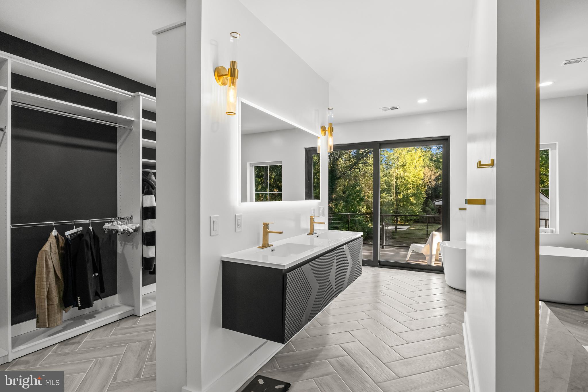 514 East Main Street Moorestown, NJ 08057 - Photo 32 of 60 a en suite bathroom with a double vanity sink and a mirror