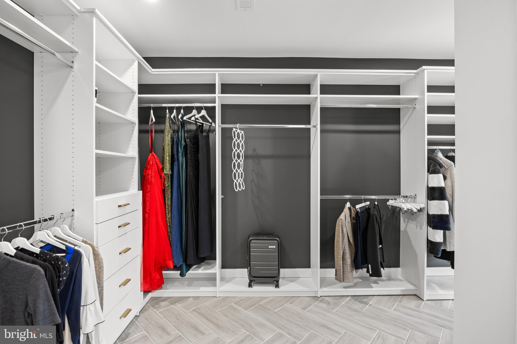 514 East Main Street Moorestown, NJ 08057 - Photo 33 of 60 a view of walk in closet with clothes and shoes