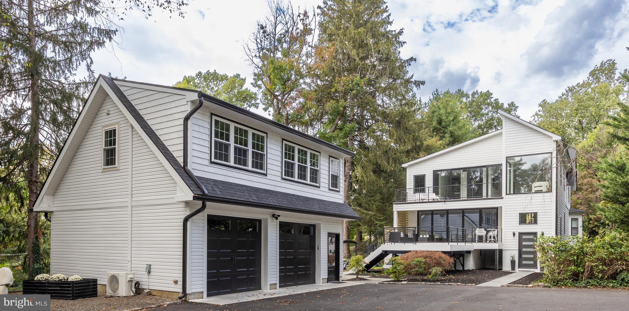 514 East Main Street Moorestown, NJ 08057 - Photo 4 of 60 a car parked in front of a white house