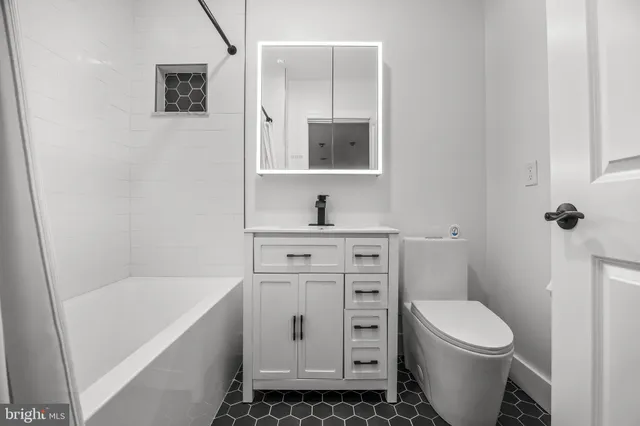 a view of a house with a tree