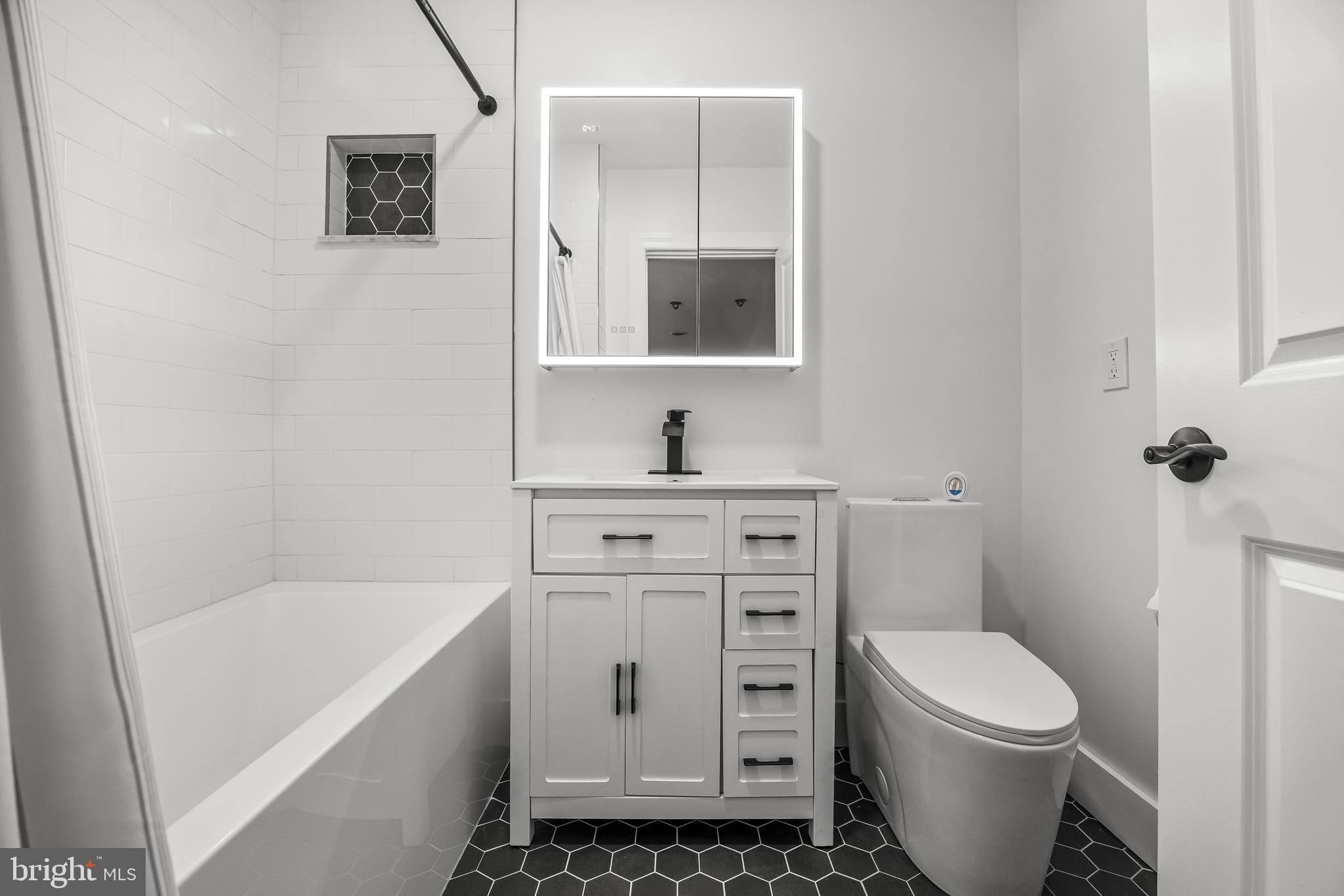 514 East Main Street Moorestown, NJ 08057 - Photo 43 of 60 a bathroom with a toilet sink and mirror