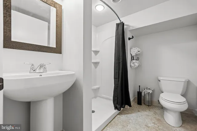 an aerial view of multiple houses with yard