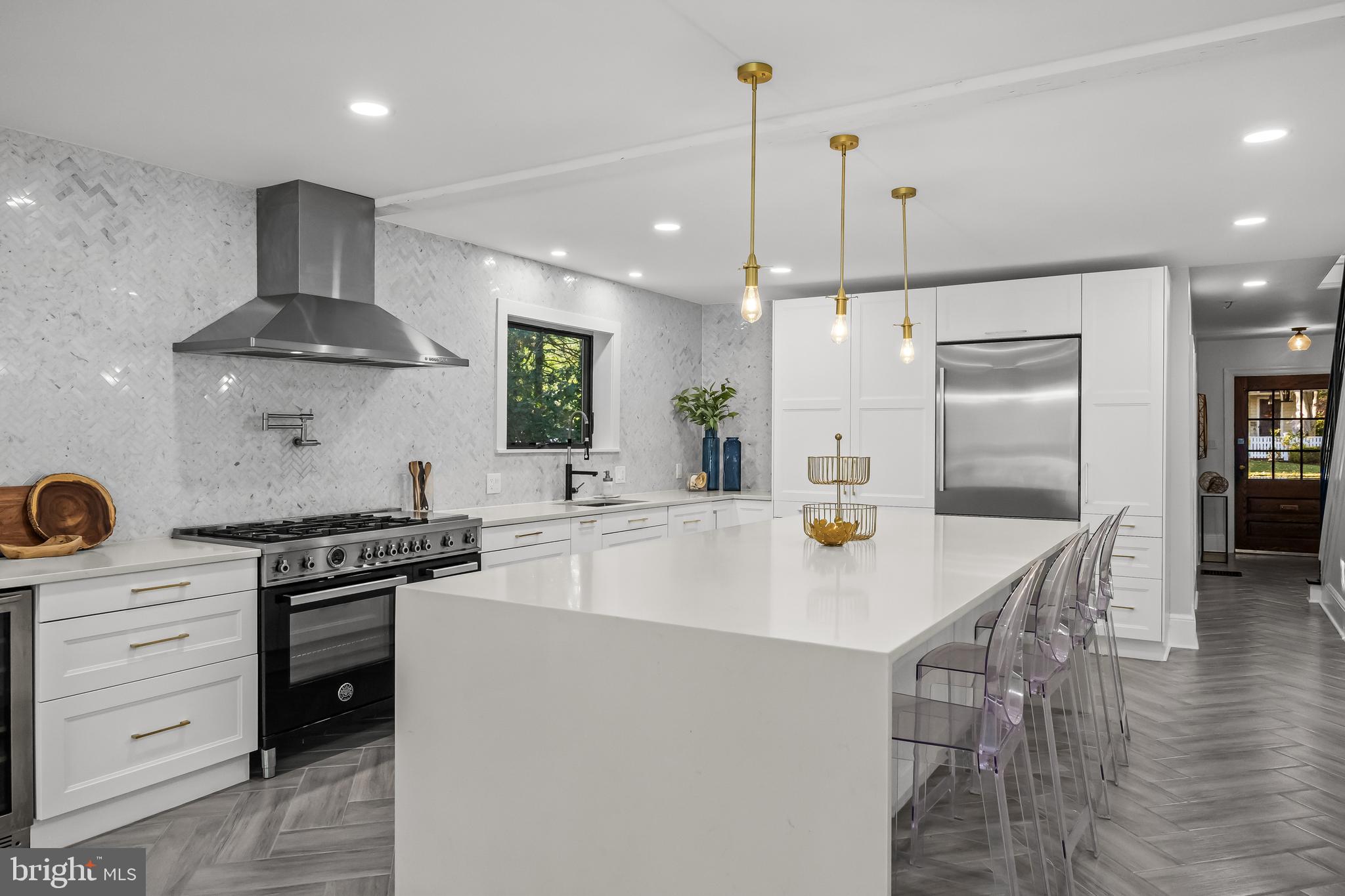 514 East Main Street Moorestown, NJ 08057 - Photo 6 of 60 a kitchen with a stove a refrigerator and a wooden floor