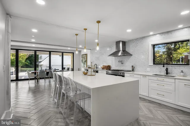 a kitchen with stainless steel appliances a stove and a refrigerator
