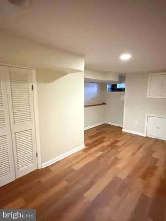 a view of a kitchen with a sink and a refrigerator
