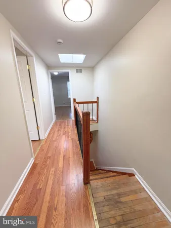 a view of an empty room and a window