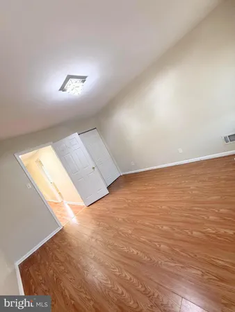 a front view of a house with a yard covered in snow