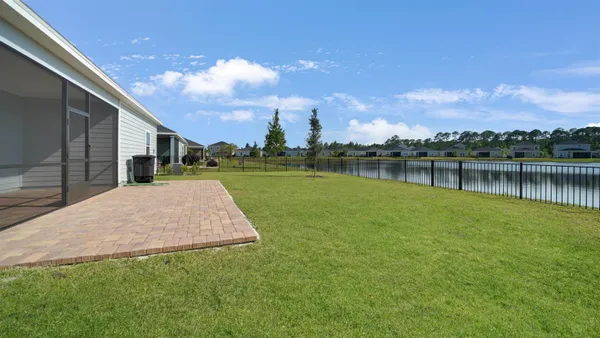 a view of a lake with a house in the background