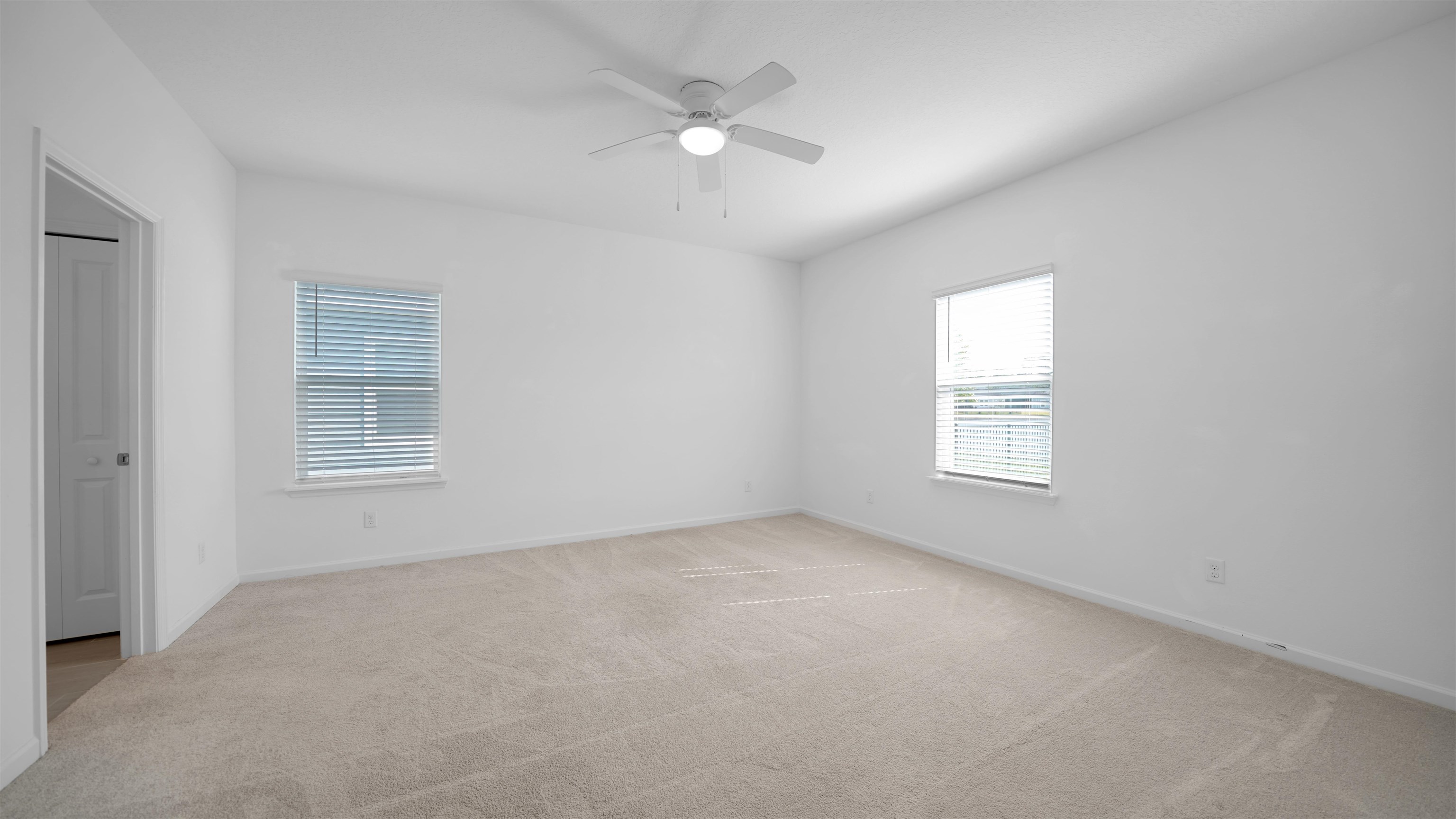 264 Lake Sinclair Street St. Augustine, FL 32084 - Photo 17 of 40 an empty room with a window and a ceiling fan