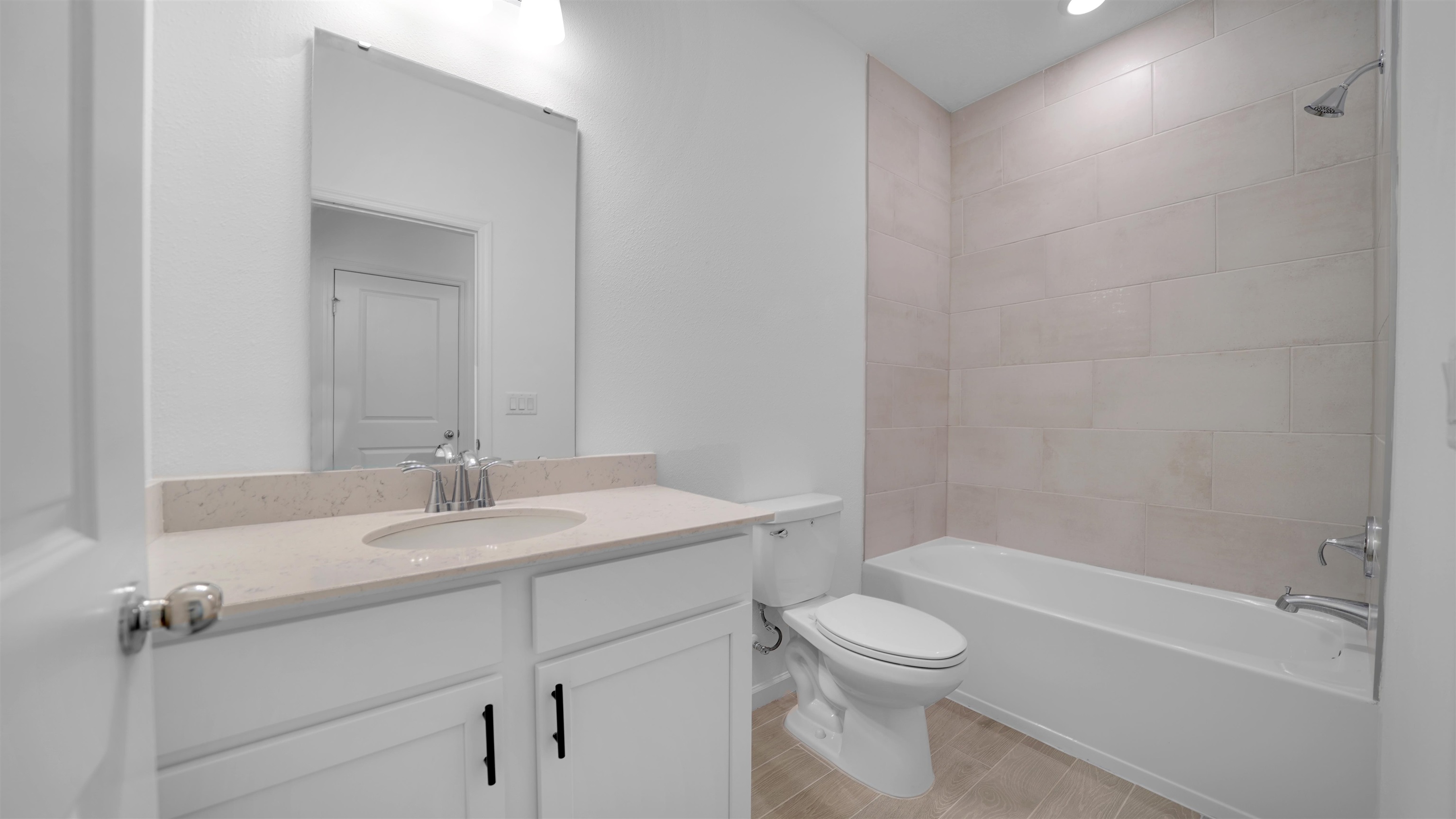 264 Lake Sinclair Street St. Augustine, FL 32084 - Photo 33 of 40 a bathroom with a granite countertop sink a toilet and a bathtub