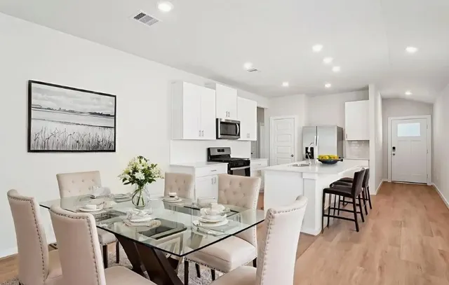 a view of a dining room with furniture