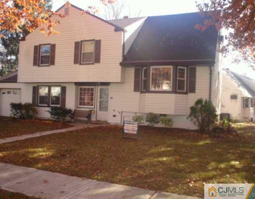 13 Meyer Road Edison, NJ 08817 - Photo 1 of 8 a front view of a house with a yard