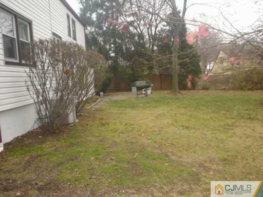 13 Meyer Road Edison, NJ 08817 - Photo 8 of 8 a view of a yard with an trees