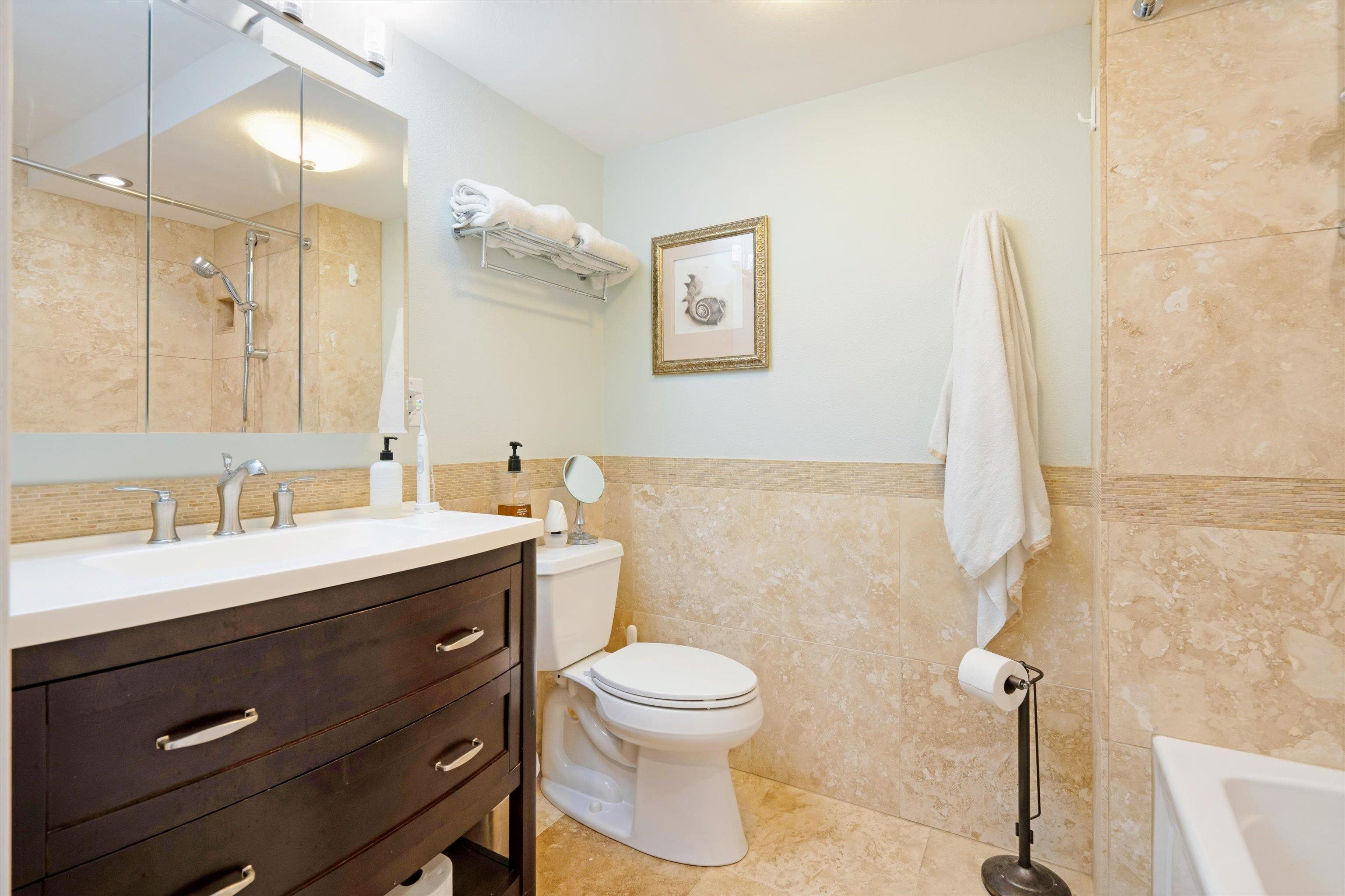 2747 South Kihei Road, Unit B203 Kihei, HI 96753 - Photo 15 of 44 a bathroom with a toilet sink and mirror