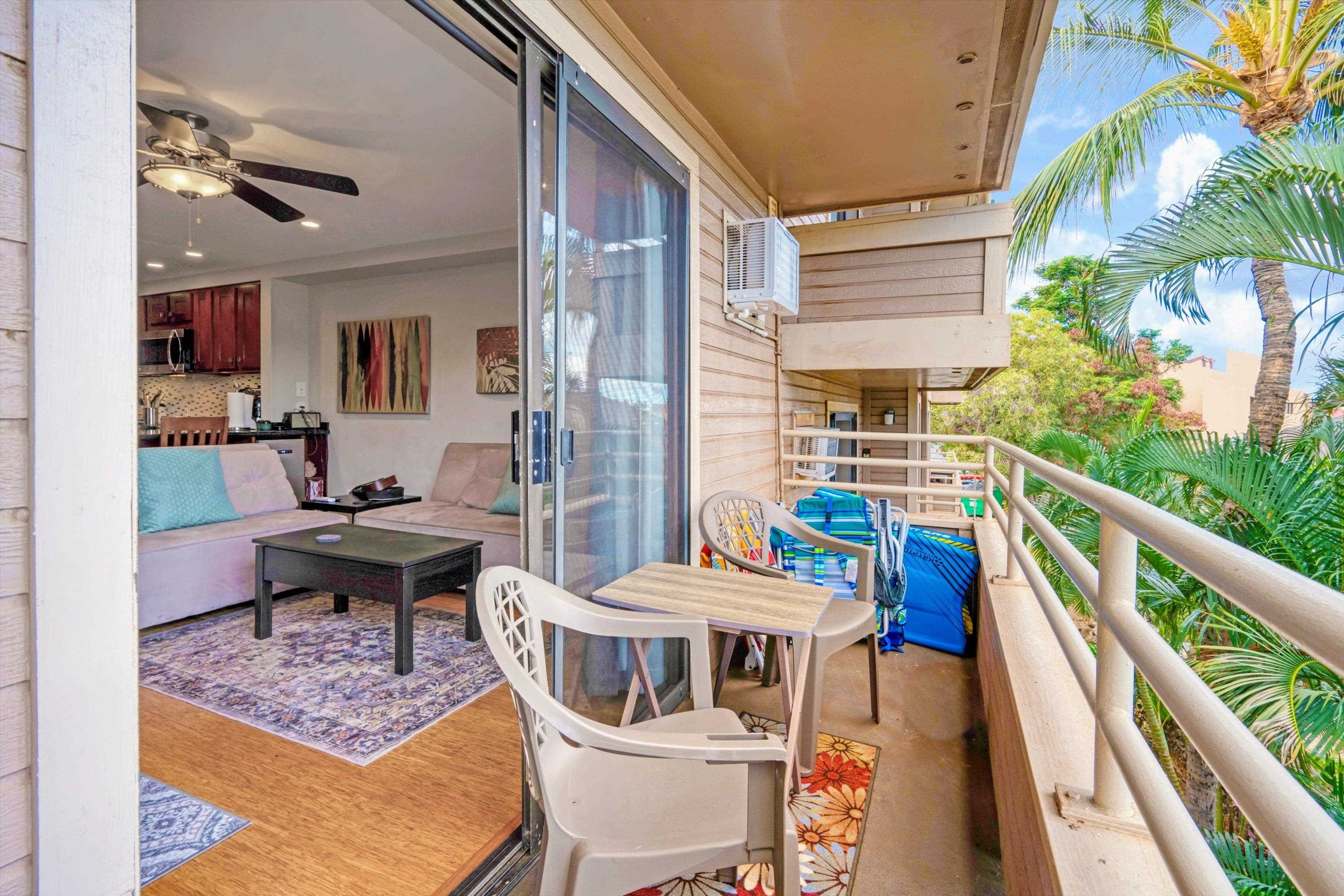 2747 South Kihei Road, Unit B203 Kihei, HI 96753 - Photo 18 of 44 a balcony with furniture and rug