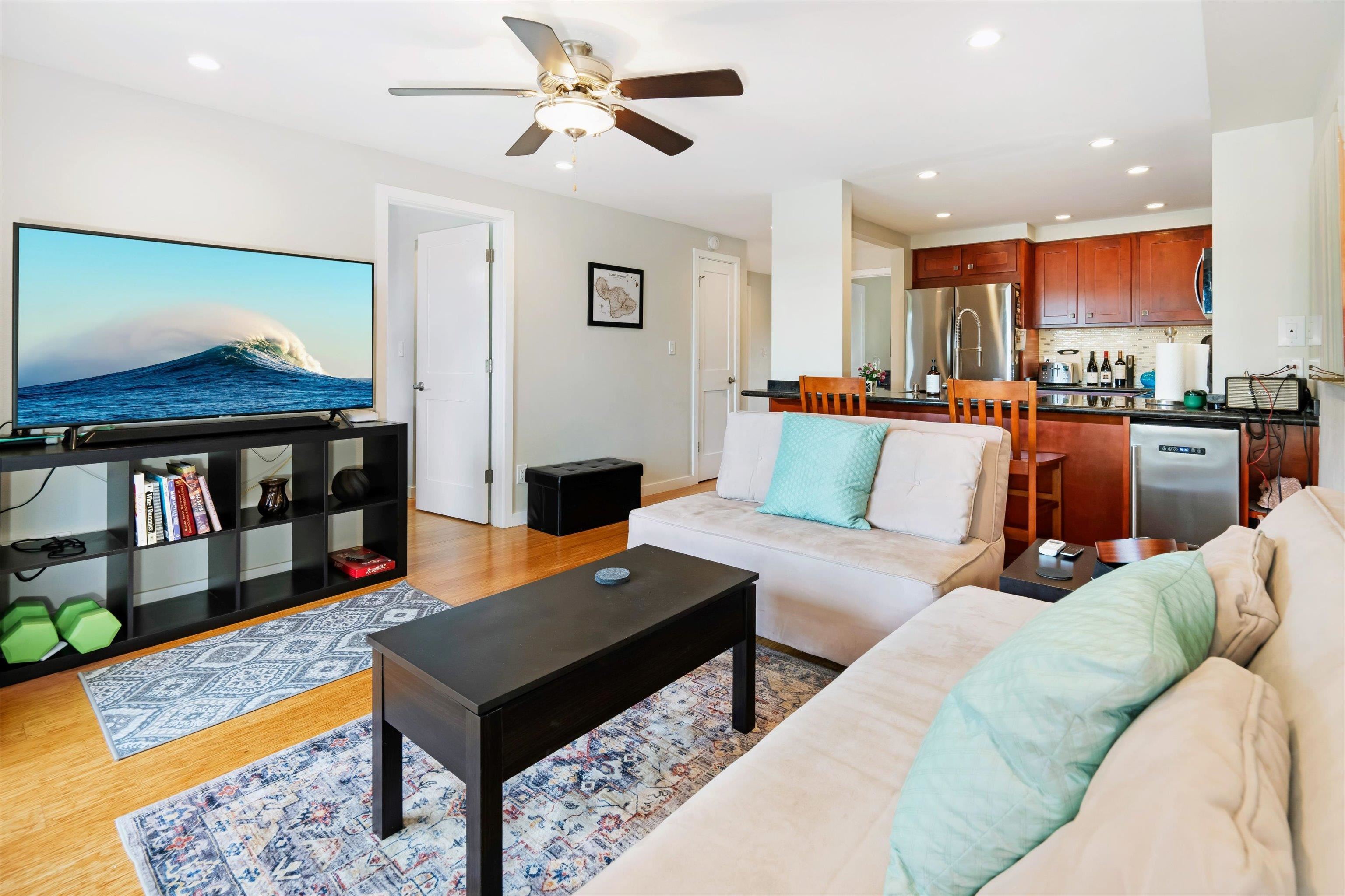 2747 South Kihei Road, Unit B203 Kihei, HI 96753 - Photo 24 of 44 a living room with furniture and a wooden floor
