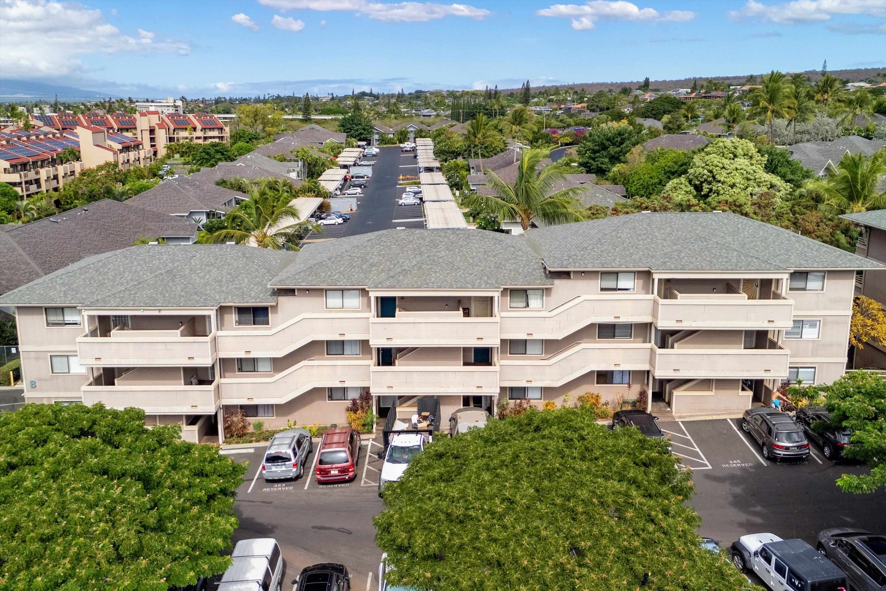 2747 South Kihei Road, Unit B203 Kihei, HI 96753 - Photo 40 of 44 an aerial view of multiple houses with a yard