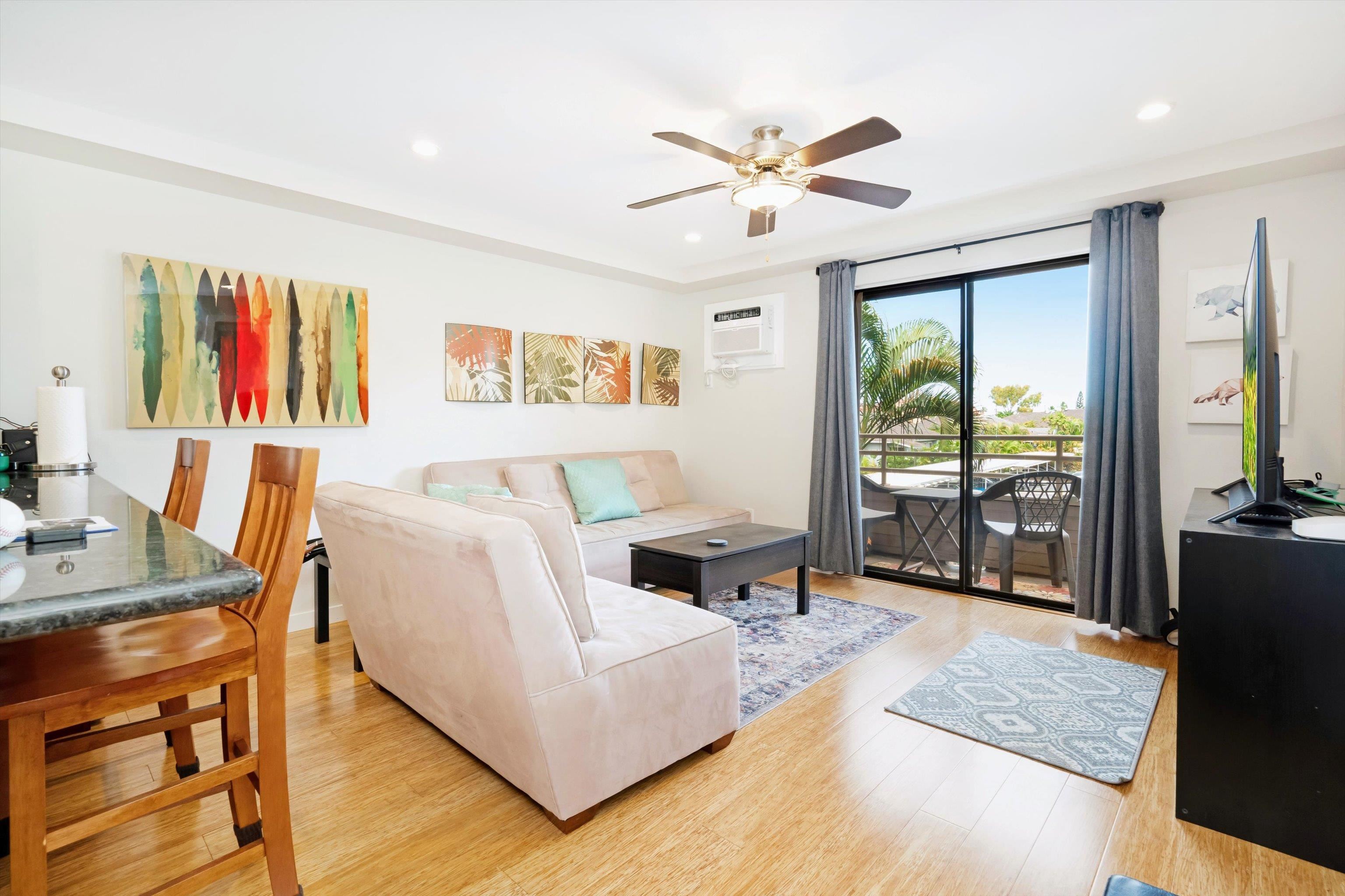 2747 South Kihei Road, Unit B203 Kihei, HI 96753 - Photo 6 of 44 a living room with furniture and a flat screen tv