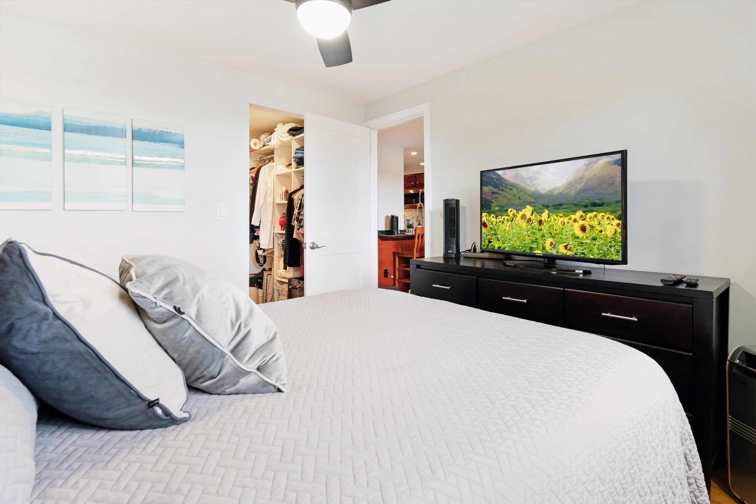 2747 South Kihei Road, Unit B203 Kihei, HI 96753 - Photo 10 of 44 a bedroom with a bed and a flat tv screen on dresser