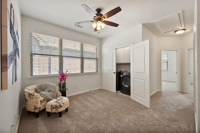 a living room with furniture and windows