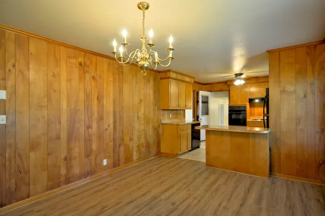 a view of a bathroom with tub and shower