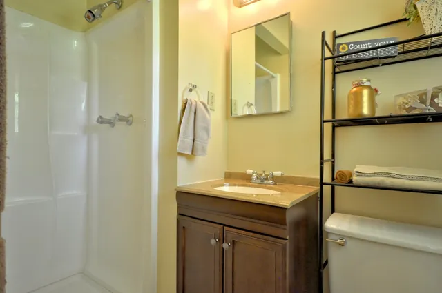 a bathroom with a sink and mirror