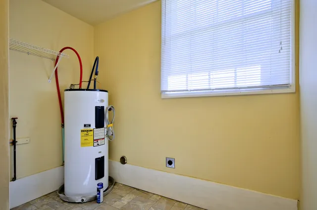 a view of a house with a yard and plants