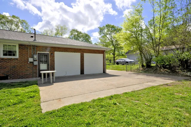 a backyard of a house with lots of green space