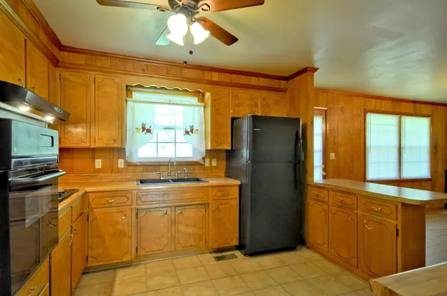 a kitchen with a refrigerator and countertop