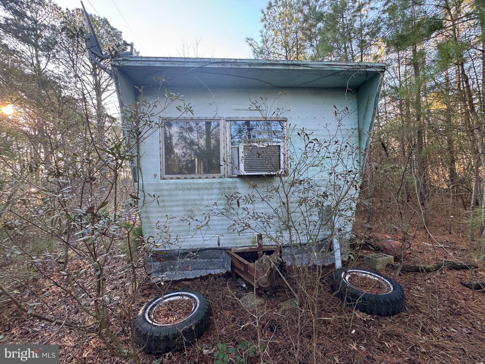 2525 Toddville Road Toddville, MD 21672 - Photo 9 of 16 a backyard of a house with chairs and table