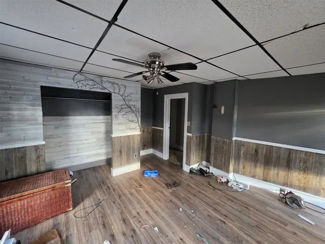 a view of a balcony with a sink and wooden floor