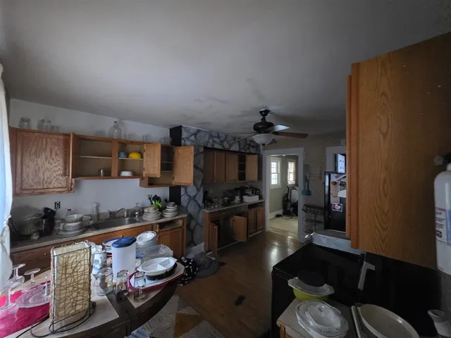 a living room with furniture chess board and a window
